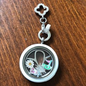 Origami Owl silver locket with golf charms.